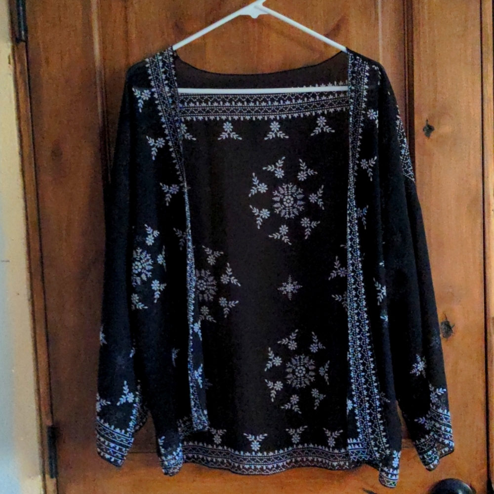 Large black shirt, open in the front